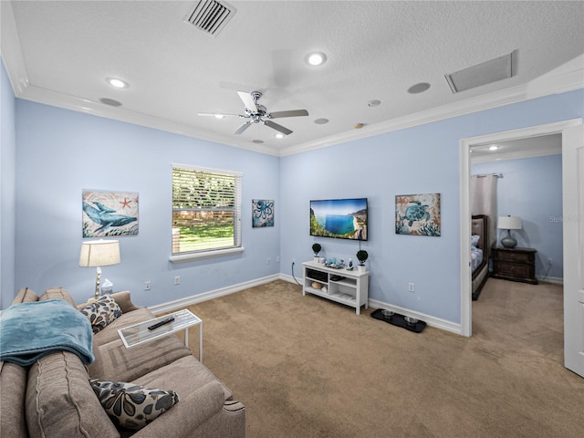 7427 20th St, Zephyrhills, FL 33540 - living room with ornamental molding, carpet floors, a ceiling fan, recessed lighting, and a textured ceiling
