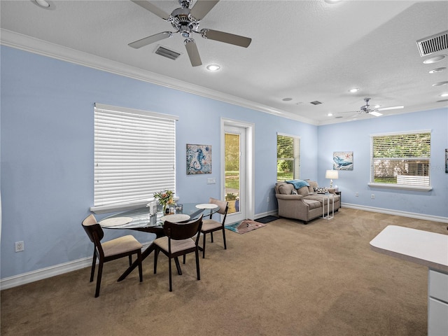 7427 20th St, Zephyrhills, FL 33540 - dining area with a ceiling fan, ornamental molding, light carpet, plenty of natural light, and recessed lighting
