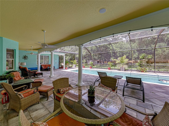 7427 20th St, Zephyrhills, FL 33540 - view of patio / terrace featuring outdoor lounge area, an outdoor pool, ceiling fan, and a lanai