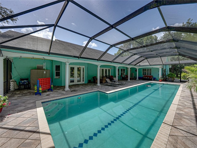 7427 20th St, Zephyrhills, FL 33540 - outdoor pool featuring french doors, a patio area, and glass enclosure