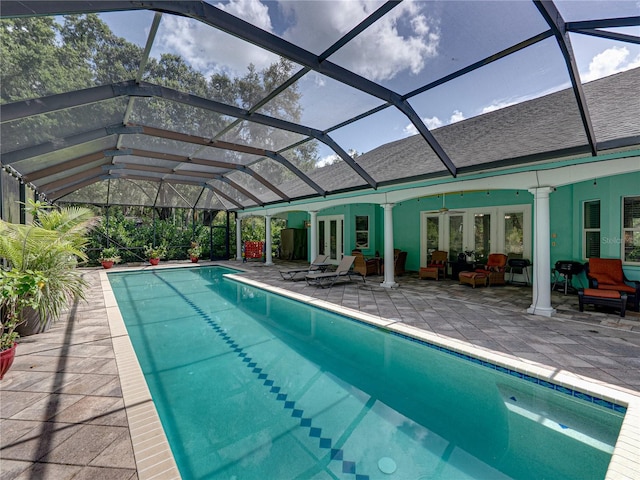 7427 20th St, Zephyrhills, FL 33540 - swimming pool featuring a patio area, french doors, a ceiling fan, and a lanai