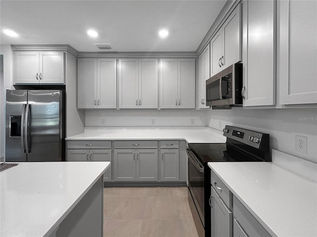 5336 Patano Loop, Palmetto, FL 34221 - kitchen with appliances with stainless steel finishes, gray cabinets, light countertops, and recessed lighting