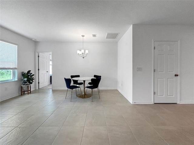 5336 Patano Loop, Palmetto, FL 34221 - dining area featuring a chandelier and light tile patterned floors