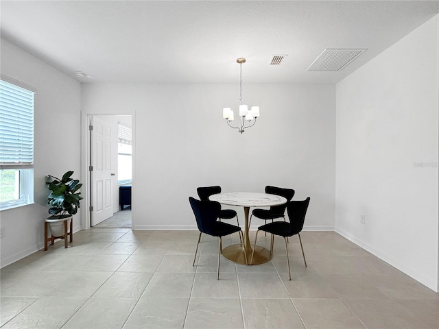 5336 Patano Loop, Palmetto, FL 34221 - dining area featuring a chandelier and light tile patterned floors