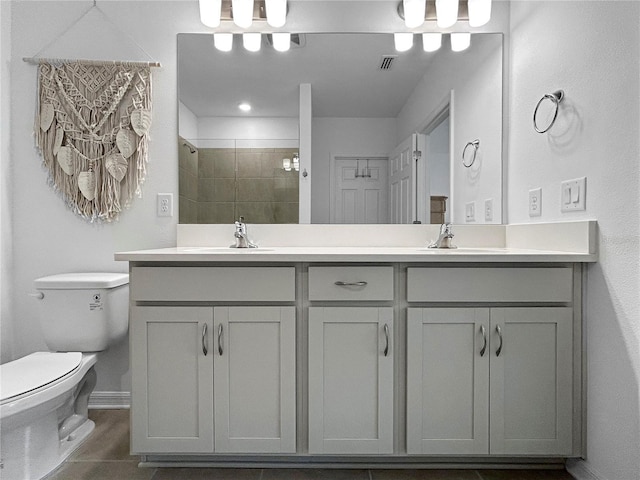 5336 Patano Loop, Palmetto, FL 34221 - bathroom featuring double vanity and a tile shower
