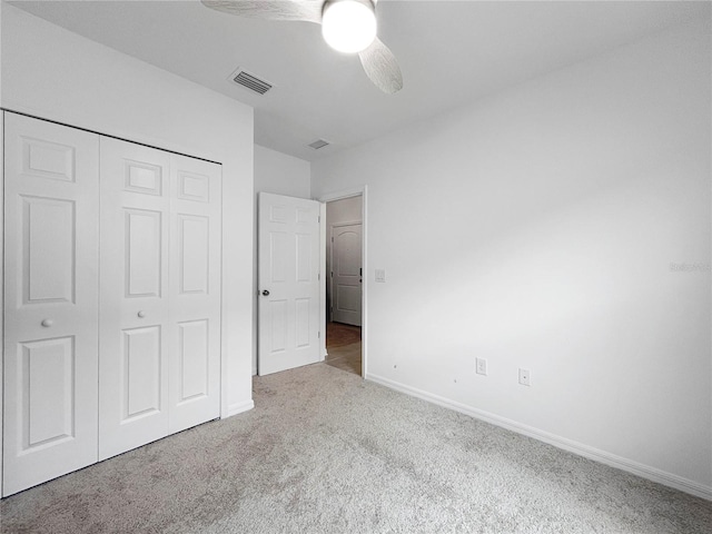 5336 Patano Loop, Palmetto, FL 34221 - unfurnished bedroom featuring carpet flooring, a closet, and a ceiling fan