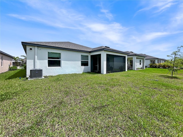 5336 Patano Loop, Palmetto, FL 34221 - rear view of house featuring a lawn, stucco siding, and a sunroom