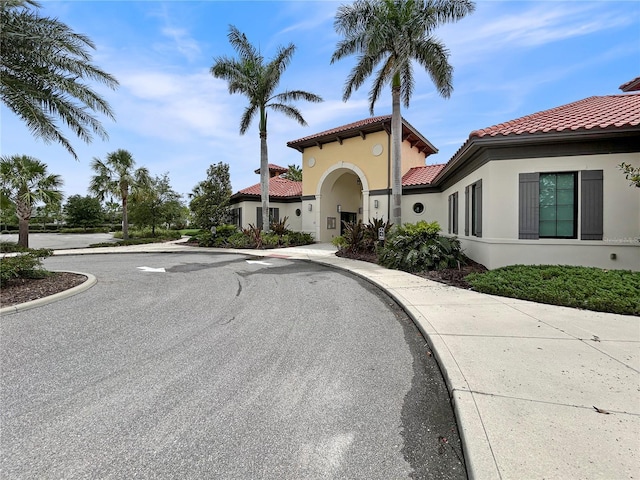 5336 Patano Loop, Palmetto, FL 34221 - view of front of home featuring a tiled roof and stucco siding