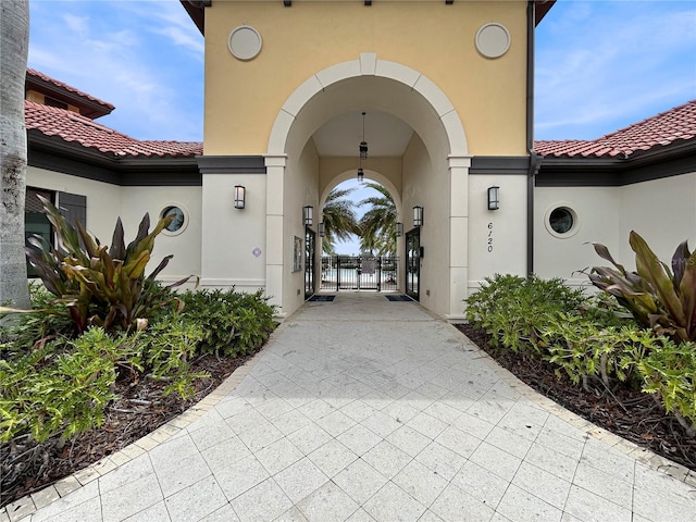 5336 Patano Loop, Palmetto, FL 34221 - doorway to property featuring a gate, stucco siding, and a tile roof