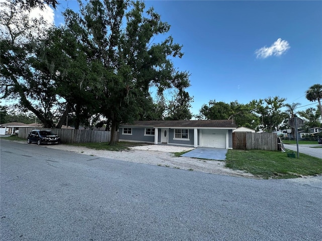 12009 Washington St, Seffner, FL 33584 - ranch-style house with driveway and a garage