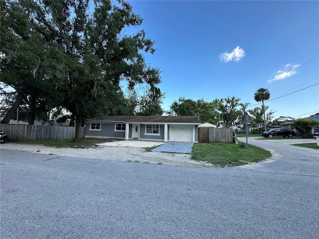 12009 Washington St, Seffner, FL 33584 - ranch-style home with driveway and an attached garage