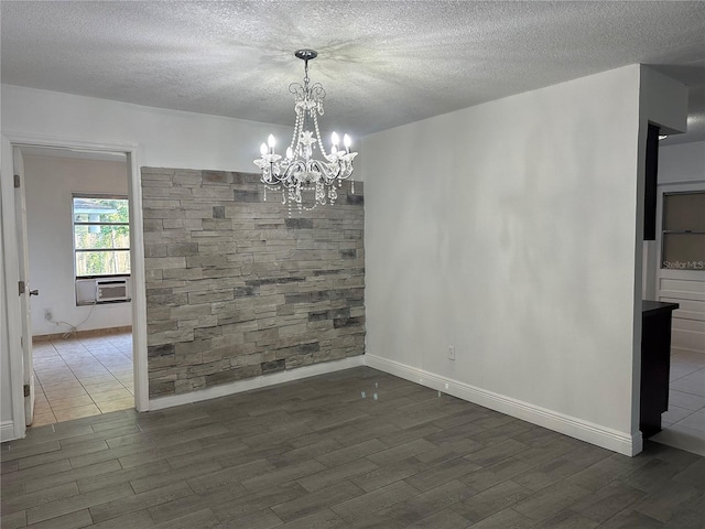 12009 Washington St, Seffner, FL 33584 - unfurnished dining area featuring wood finished floors, a textured ceiling, cooling unit, and a chandelier