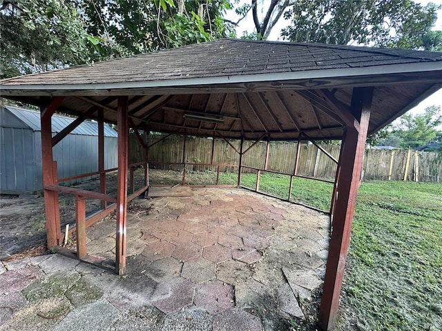 12009 Washington St, Seffner, FL 33584 - view of parking featuring a fenced backyard and a detached carport