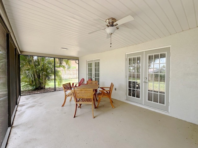 1548 Foxboro Dr, Palm Harbor, FL 34683 - sunroom featuring french doors and concrete floors