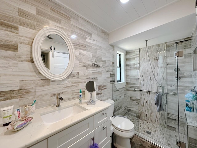 1548 Foxboro Dr, Palm Harbor, FL 34683 - full bath with vanity, a shower stall, tile walls, and decorative backsplash
