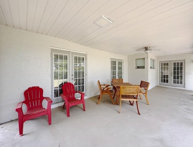1548 Foxboro Dr, Palm Harbor, FL 34683 - view of patio featuring french doors, ceiling fan, and outdoor dining area