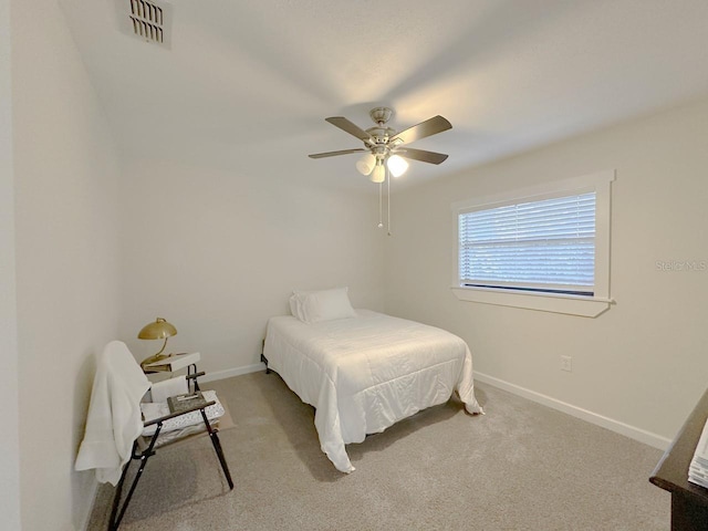 1548 Foxboro Dr, Palm Harbor, FL 34683 - carpeted bedroom with baseboards and ceiling fan