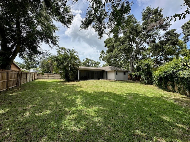 1548 Foxboro Dr, Palm Harbor, FL 34683 - fenced backyard with a sunroom