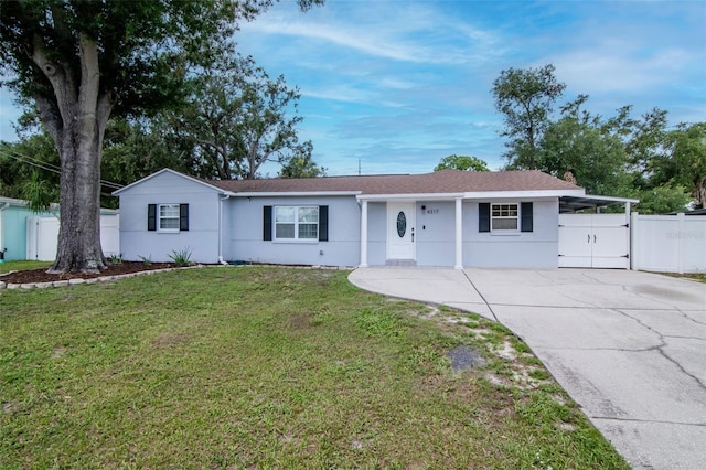 4317 S Hale Ave, Tampa, FL 33611 - single story home featuring driveway, stucco siding, and a gate