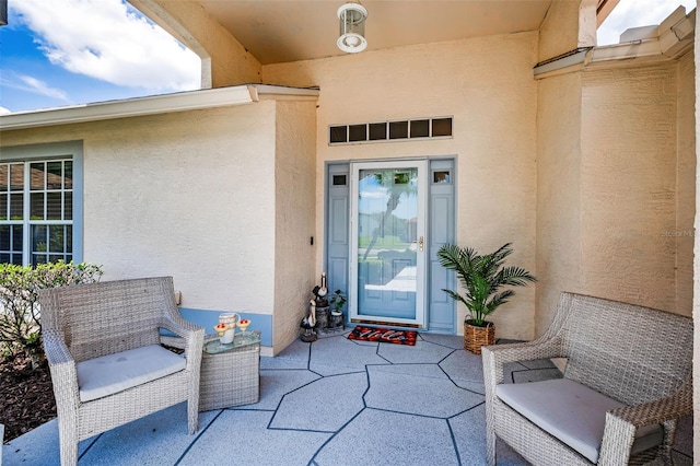 1115 Ashbourne Cir, Trinity, FL 34655 - property entrance featuring stucco siding and a patio