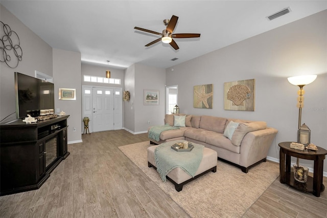 1115 Ashbourne Cir, Trinity, FL 34655 - living room featuring light wood-style floors and a ceiling fan