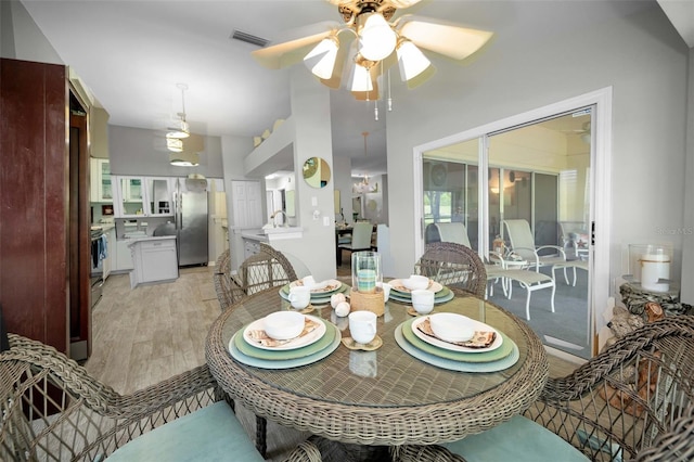 1115 Ashbourne Cir, Trinity, FL 34655 - dining room with light wood finished floors and ceiling fan