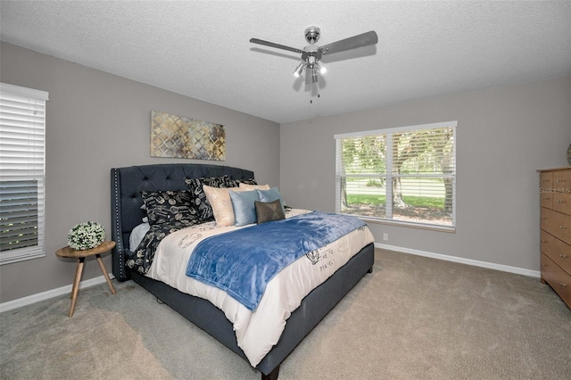 1115 Ashbourne Cir, Trinity, FL 34655 - bedroom with carpet, a textured ceiling, and a ceiling fan