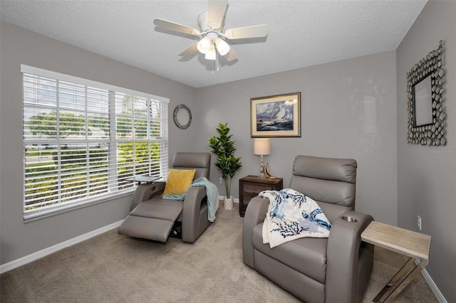 1115 Ashbourne Cir, Trinity, FL 34655 - living area with ceiling fan, light carpet, and a textured ceiling