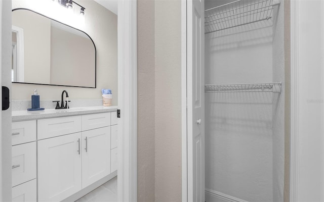 3907 W Walnut St, Tampa, FL 33607 - bathroom with vanity and a spacious closet