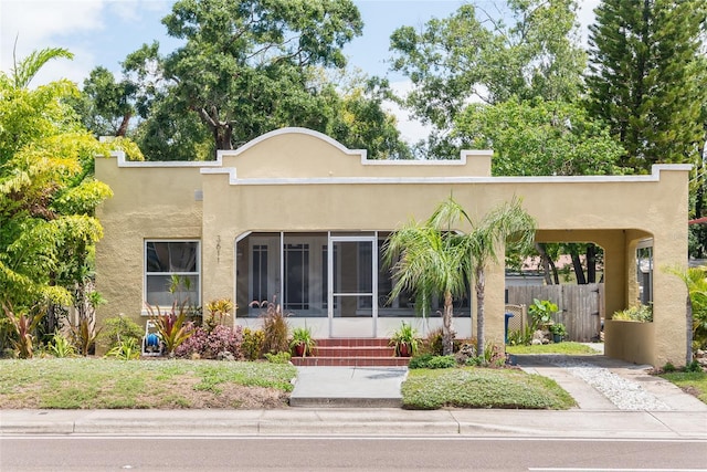 3611 W Bay To Bay Blvd, Tampa, FL 33611 - mediterranean / spanish-style house featuring stucco siding and a sunroom
