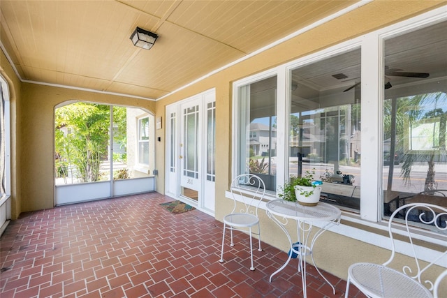 3611 W Bay To Bay Blvd, Tampa, FL 33611 - sunroom / solarium featuring brick patterned floors and wooden ceiling