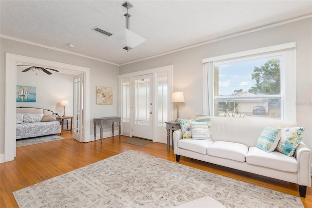 3611 W Bay To Bay Blvd, Tampa, FL 33611 - living room with hardwood / wood-style flooring and ornamental molding