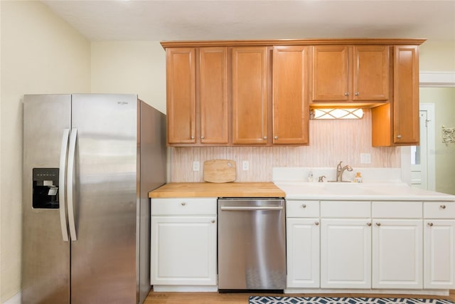 3611 W Bay To Bay Blvd, Tampa, FL 33611 - kitchen with stainless steel appliances, light countertops, and white cabinetry