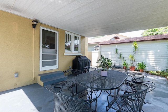 3611 W Bay To Bay Blvd, Tampa, FL 33611 - view of patio / terrace featuring grilling area, entry steps, and outdoor dining area