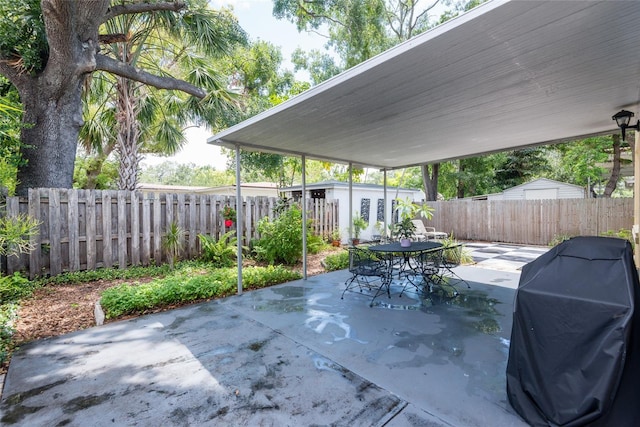 3611 W Bay To Bay Blvd, Tampa, FL 33611 - fenced backyard featuring a patio, outdoor dining space, and area for grilling