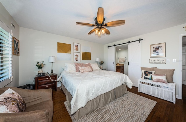 1324 Pasadena Ave S Unit 501, South Pasadena, FL 33707 - bedroom with a barn door, wood finished floors, connected bathroom, and a ceiling fan