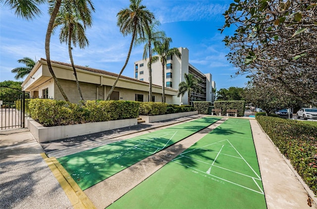 1324 Pasadena Ave S Unit 501, South Pasadena, FL 33707 - surrounding community with shuffleboard and a gate