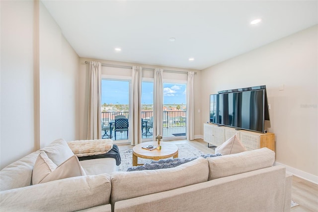 400 150th Ave Unit 504, Madeira Beach, FL 33708 - living room featuring light wood-style floors and recessed lighting