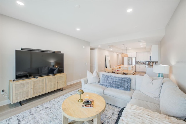 400 150th Ave Unit 504, Madeira Beach, FL 33708 - living area with light wood finished floors and recessed lighting