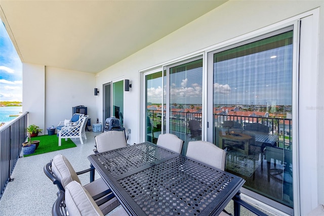 400 150th Ave Unit 504, Madeira Beach, FL 33708 - balcony featuring outdoor dining area