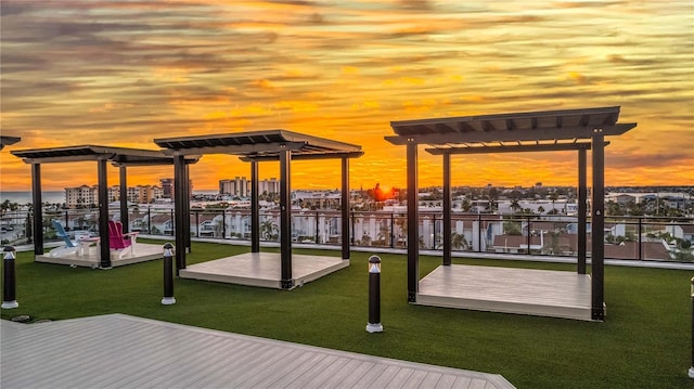 400 150th Ave Unit 504, Madeira Beach, FL 33708 - dock area featuring a pergola, a lawn, and a water view