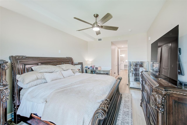 400 150th Ave Unit 504, Madeira Beach, FL 33708 - bedroom featuring light wood-type flooring, ceiling fan, and connected bathroom