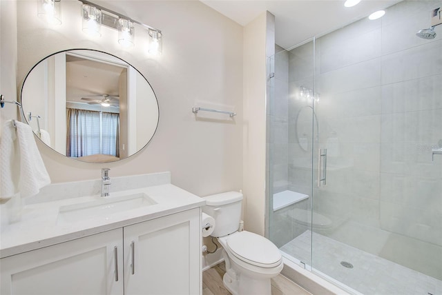 400 150th Ave Unit 504, Madeira Beach, FL 33708 - full bath with a ceiling fan, vanity, a stall shower, and wood finished floors