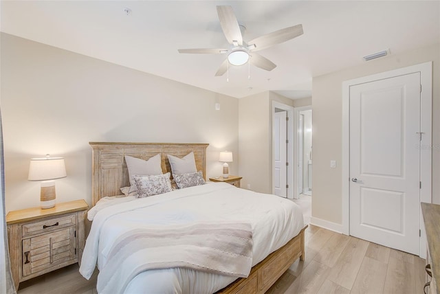 400 150th Ave Unit 504, Madeira Beach, FL 33708 - bedroom with light wood-style floors and ceiling fan