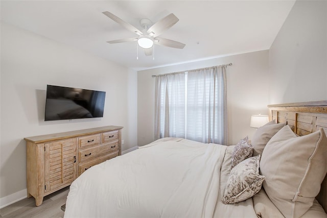 400 150th Ave Unit 504, Madeira Beach, FL 33708 - bedroom featuring light wood-style flooring and ceiling fan