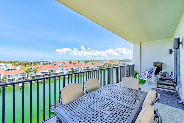 400 150th Ave Unit 504, Madeira Beach, FL 33708 - balcony with outdoor dining space and a water view