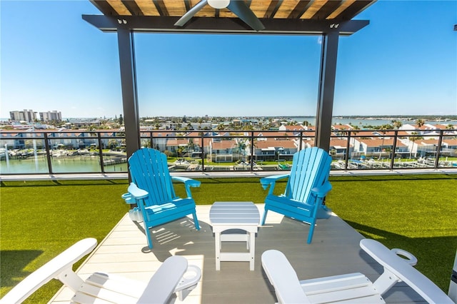 400 150th Ave Unit 504, Madeira Beach, FL 33708 - view of patio / terrace with a ceiling fan and a water view