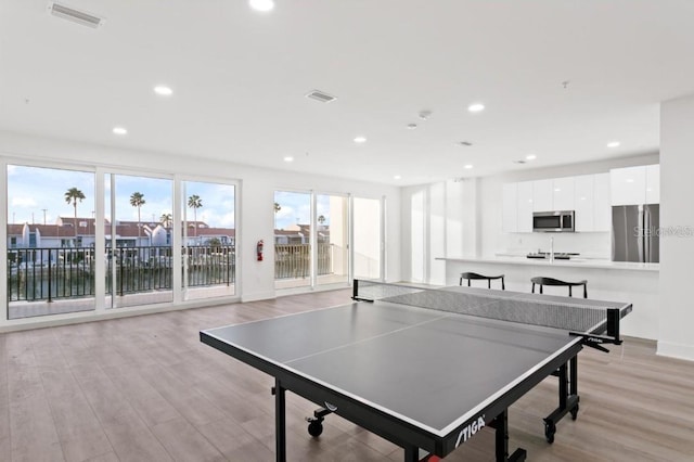 400 150th Ave Unit 504, Madeira Beach, FL 33708 - playroom featuring light wood-type flooring and recessed lighting