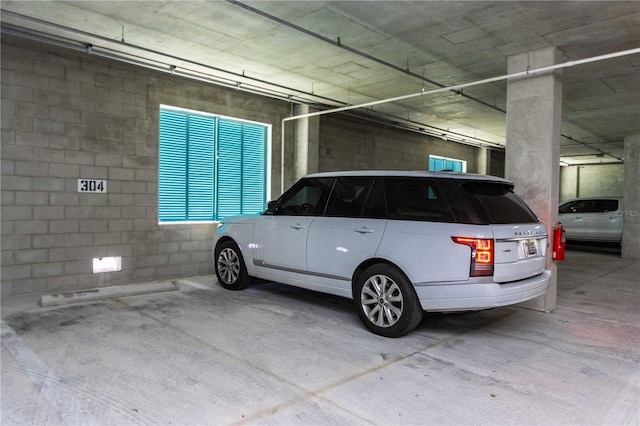 400 150th Ave Unit 504, Madeira Beach, FL 33708 - parking garage with concrete block wall