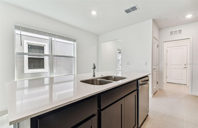10426 Cross River Trl, Parrish, FL 34219 - kitchen featuring dishwasher, light tile patterned floors, light stone countertops, and recessed lighting